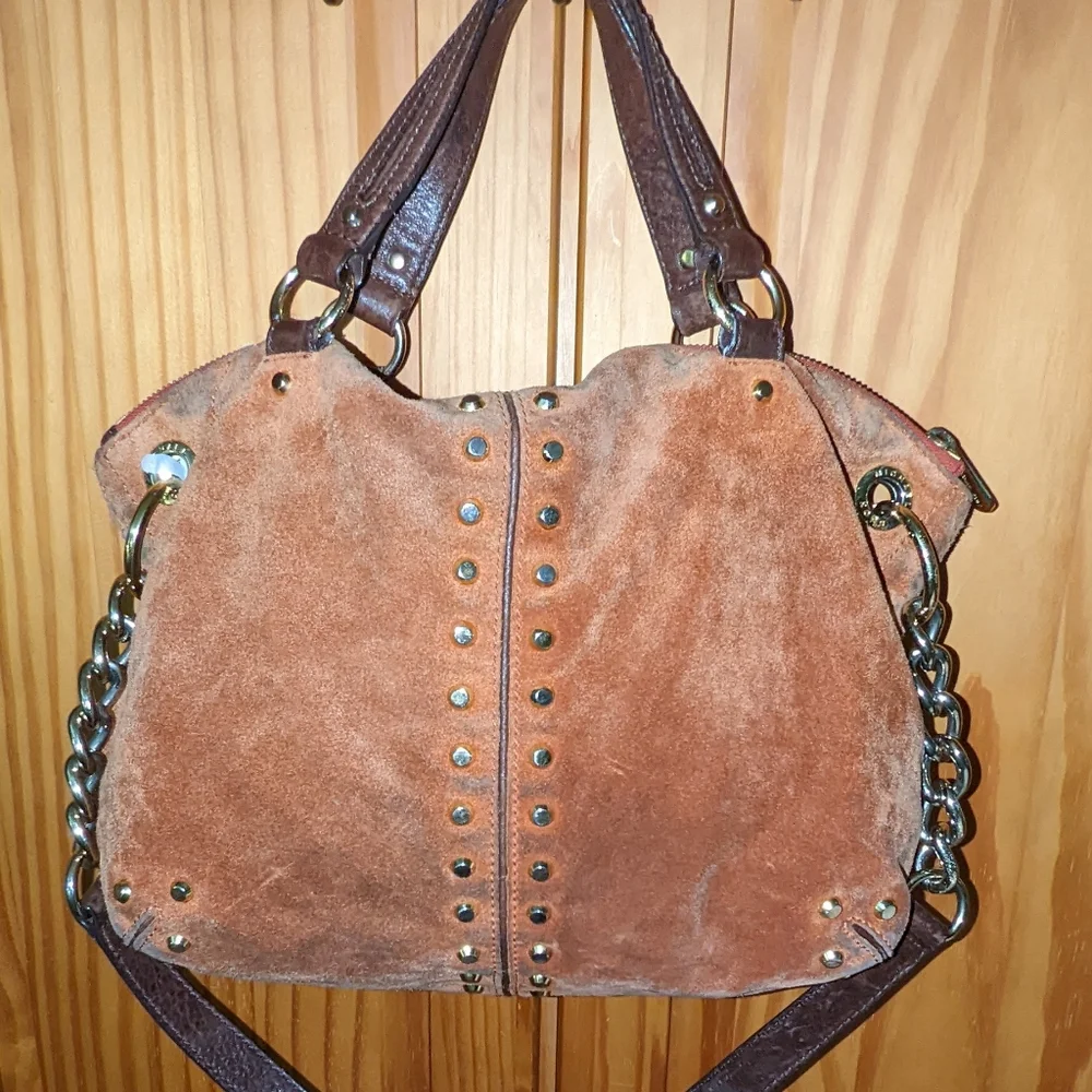Michael Kors orange suede studded slouchy shoulder bag.